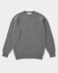 A classic gray knit crewneck sweater with ribbed cuffs and hem, laid flat against a light gray background. The brand name 'Harris' is visible on the inner neck label.